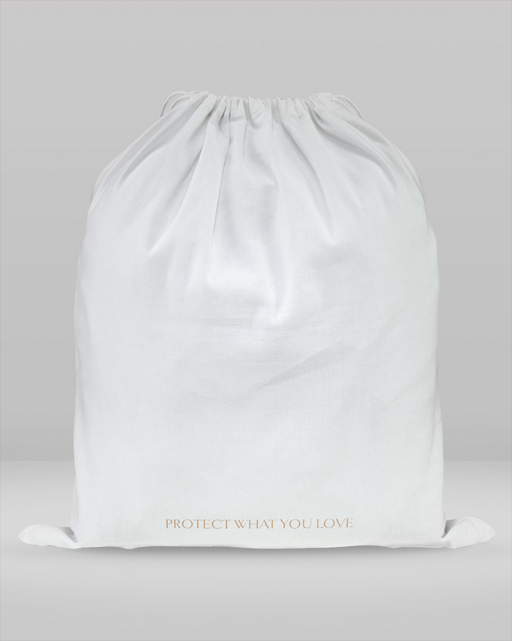 a rear view of a large dust bag with the writing 'protect what you love' 