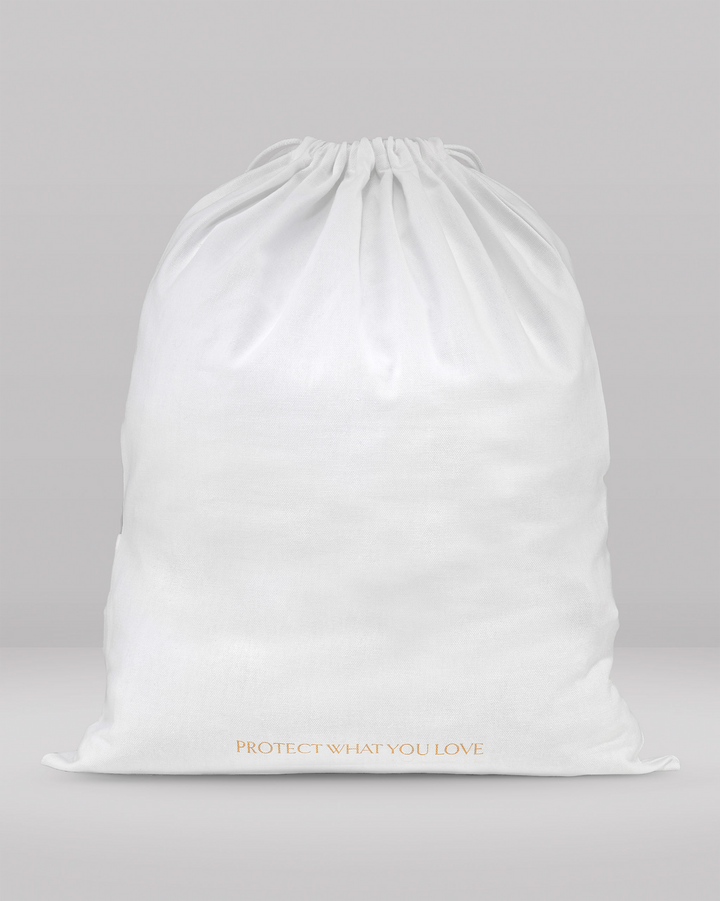 a rear view of a medium size dust bag showing the words 'protect what you love'