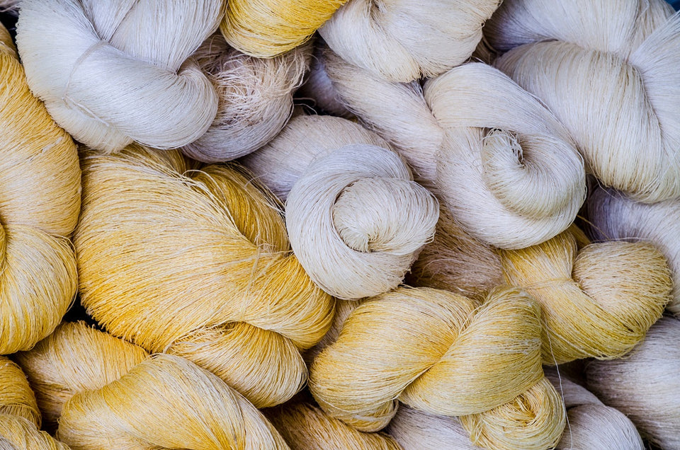 raw and white silk threads