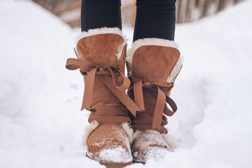 suede fur-lined tie-up boots keeping feet warm in the snow