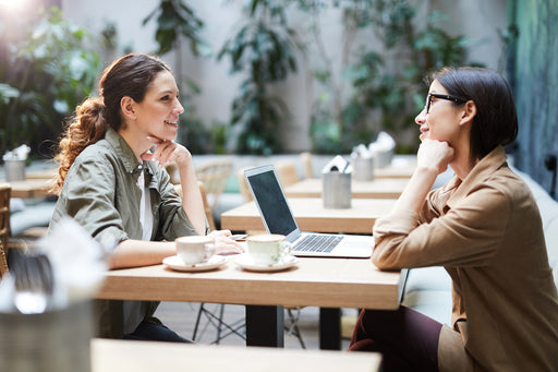 two women meeting for a business in a coffee shop