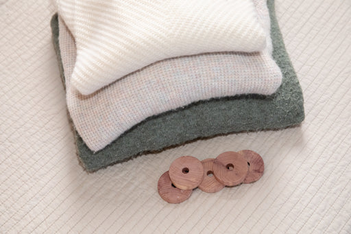 woollen sweaters with a collection of cedarwood blocks that can also be used on hangers